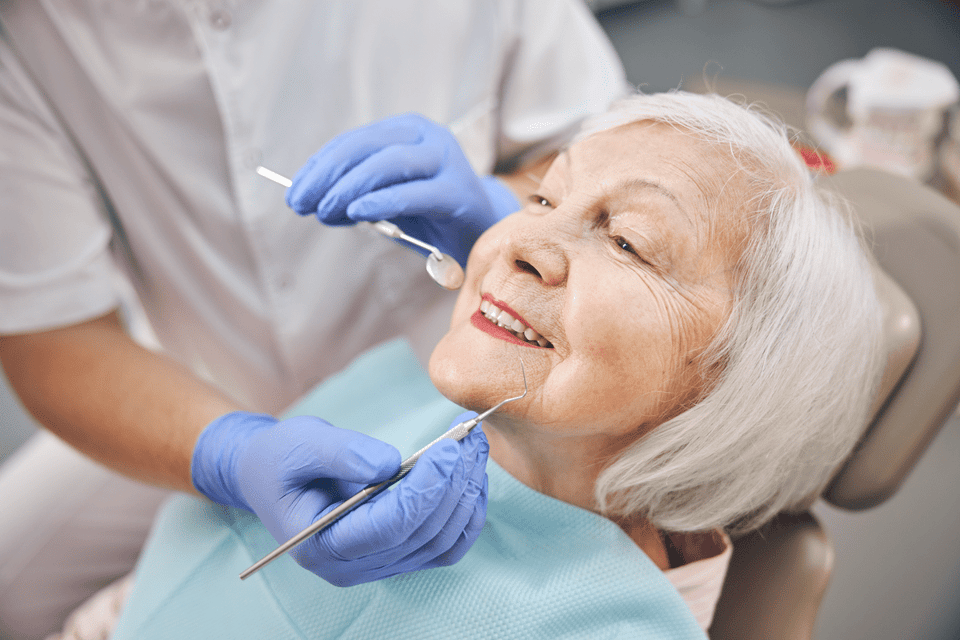 Doctor is holding dental tools wearing gloves