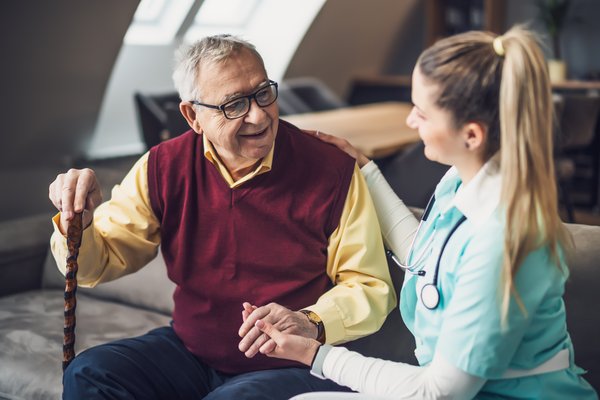 assisted-living-elderly-man-nurse-home-care