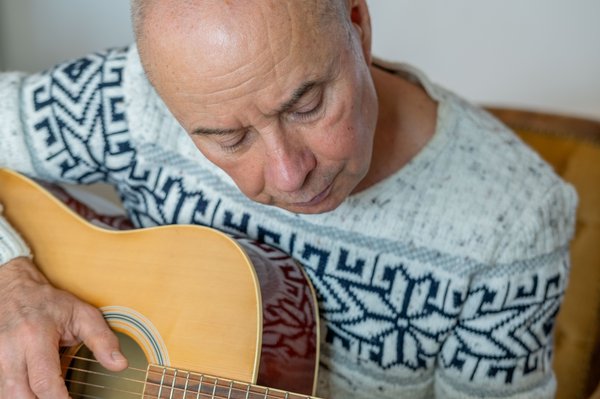 activities-senior-man-playing-acoustic-guitar