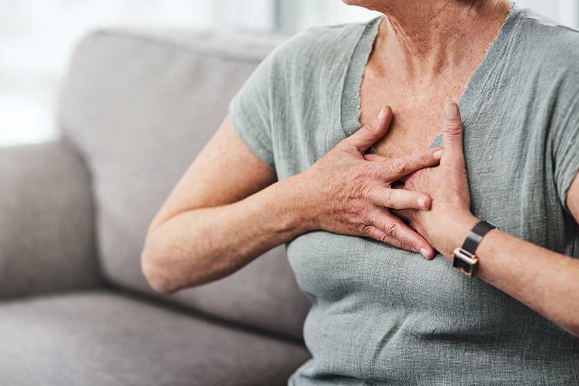 Heart attack, chest pain and sick senior woman